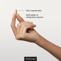 THORNE probiotic capsules shown in hand ready for daily routine.