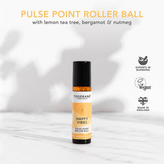 Tisserand Happy Vibes applied to the wrist for quick scent refresh.