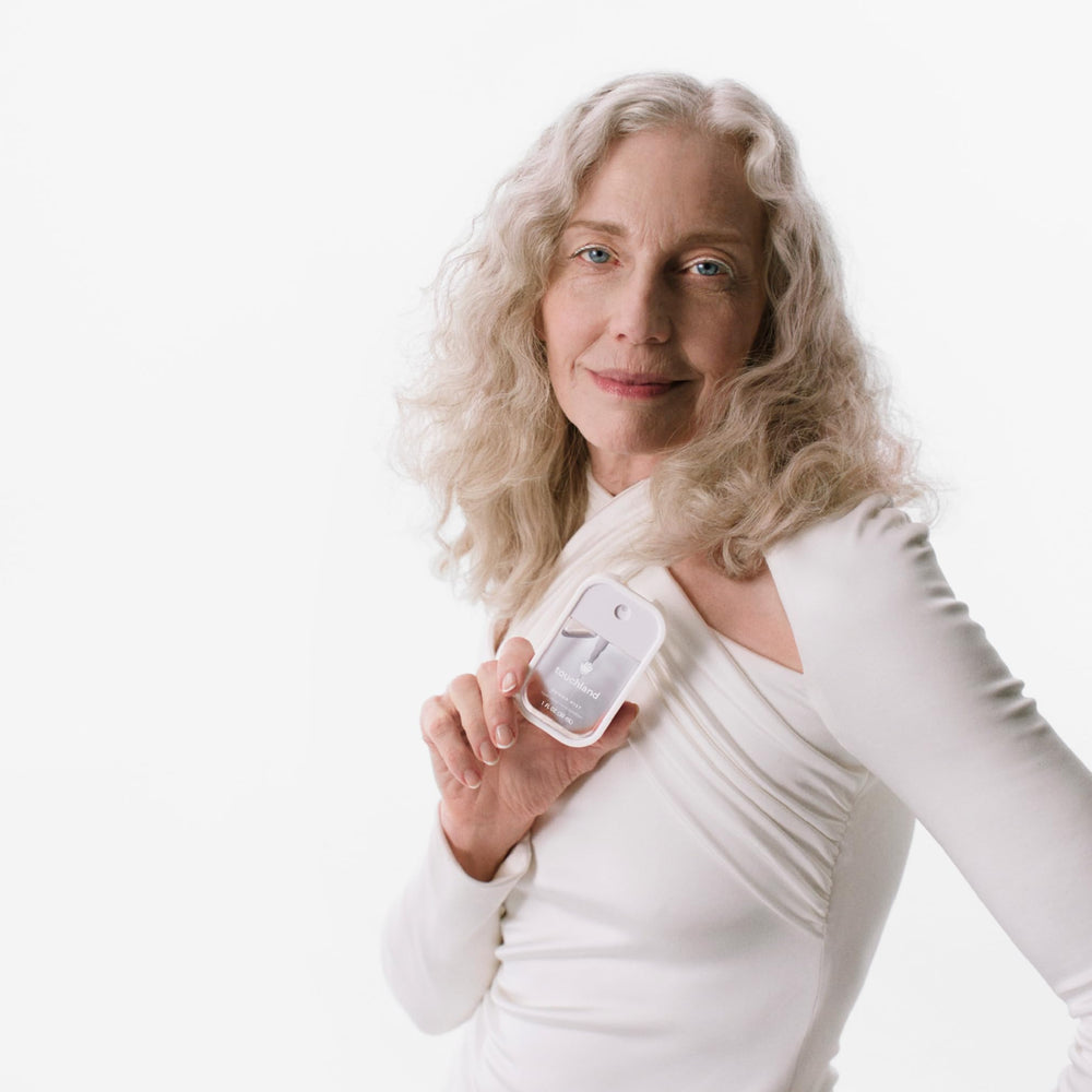 Touchland Gentle Mist bottle close-up highlighting soothing Niacinamide formula