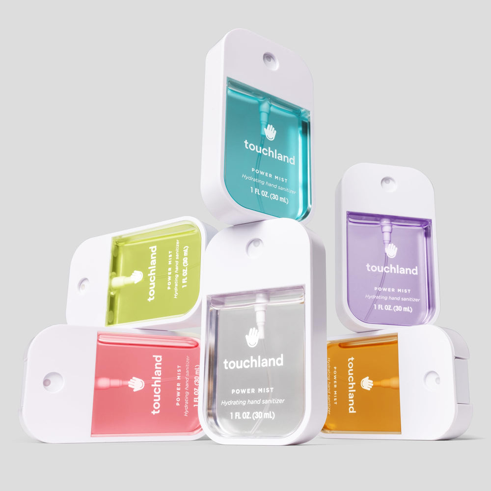 On-the-go application of Touchland Berry Bliss in a purse or pocket.