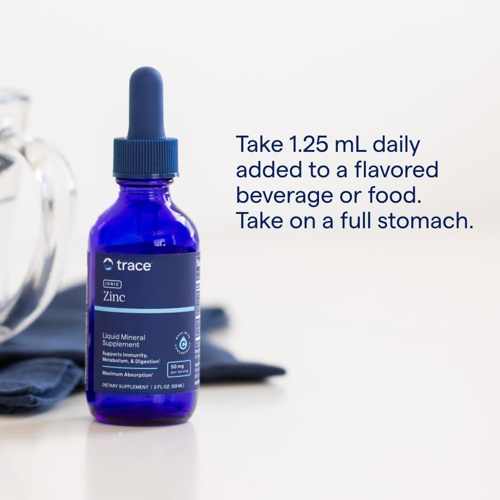 Trace Minerals Ionic Zinc drops liquid in a glass ready to mix with your drink.