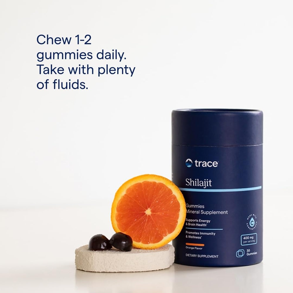 Trace Minerals Shilajit Gummies with water for easy digestion support.