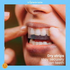 Triple Bristle whitening strips being applied to upper teeth for gentle whitening