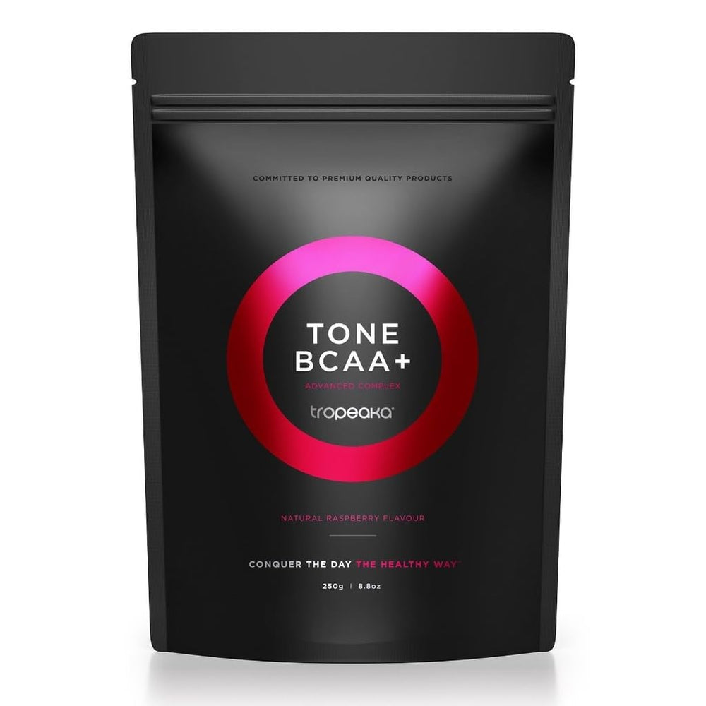 Tropeaka Tone BCAA+ tub on gym counter for lean muscle support.