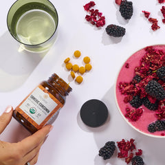 Truvani bottle paired with cup and spoon suggesting daily wellness routine