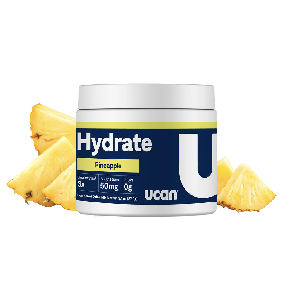 UCAN Hydrate pineapple powder scoop for quick, sugar-free hydration.