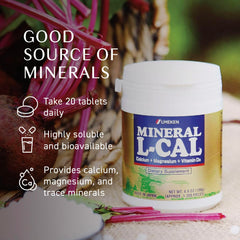 Hands holding the small, easy-to-swallow Mineral L-Cal balls.