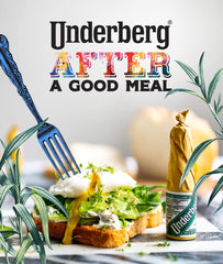 Herbal digestif scene with glass under warm candlelight