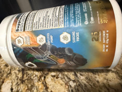 Underground Bio Labs Pando Pre-Workout scoop in hand suggests precise serving sizes