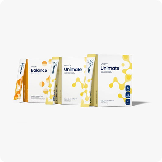 Unicity Balance Natural Orange bottle pouring for a refreshing daily routine.