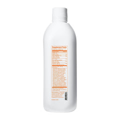 Univera km glass bottle on table showcases premium packaging.
