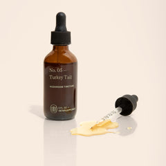 Dropper pours UPHORIC URTH tincture for quick absorption.