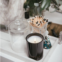 Hand-poured Ortus Discovery candle in Vancouver studio setup.
