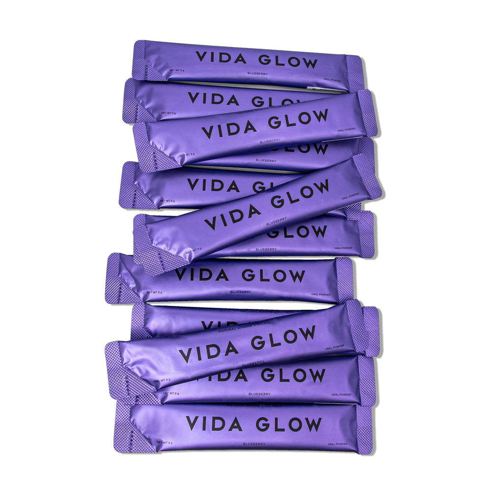 Vida Glow Marine Collagen powder mixed into a drink for skin glow.