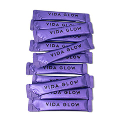 Vida Glow Marine Collagen powder mixed into a drink for skin glow.