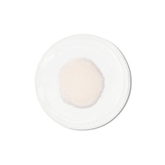 Vida Glow pineapple collagen sachets beside a glass for a convenient beauty routine.