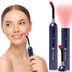 Vitalume red light wand in hand showing a compact design for on-the-go therapy.