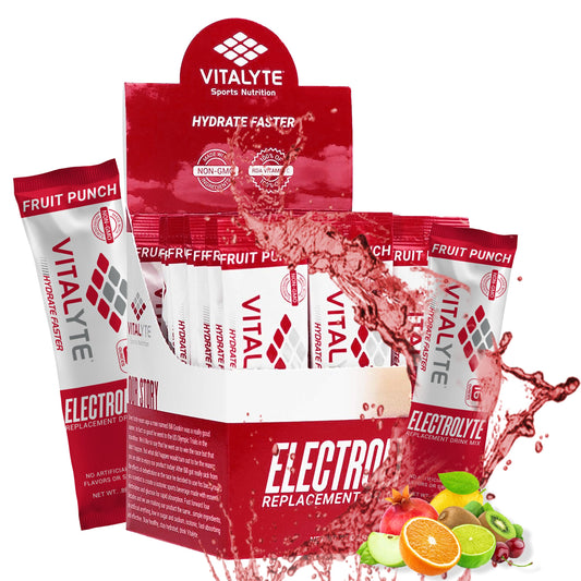 Vitalyte electrolyte packets in fruit punch packaging ready for travel hydration.