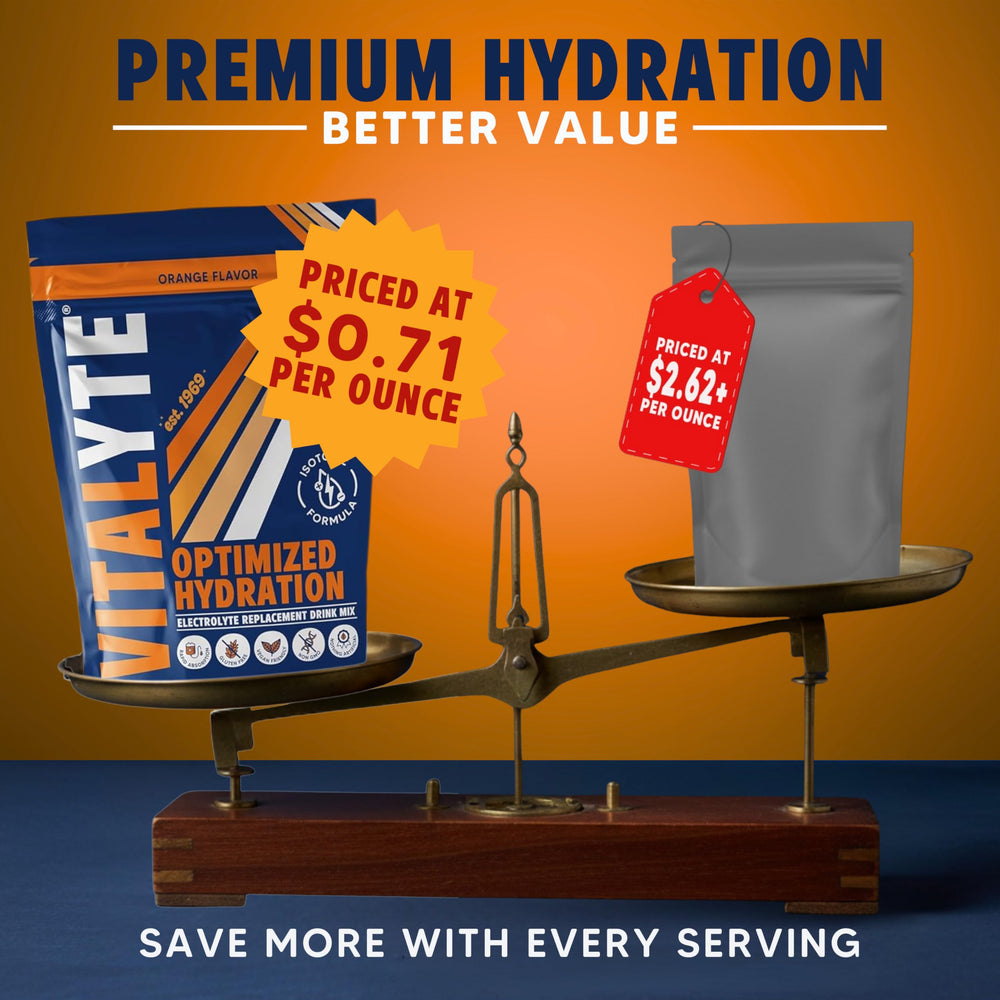 Vitalyte glass of orange electrolyte drink after mixing for rapid hydration