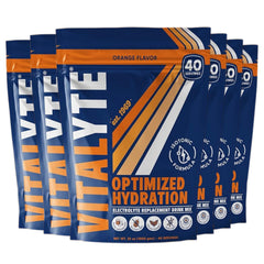 Vitalyte orange electrolyte powder tub close-up showing brand and texture for rapid hydration