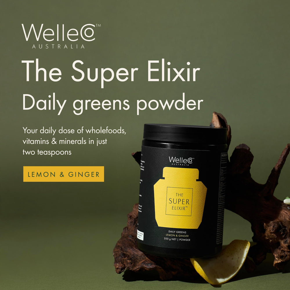 WelleCo Super Elixir daily greens powder being poured into a glass for easy mixing.