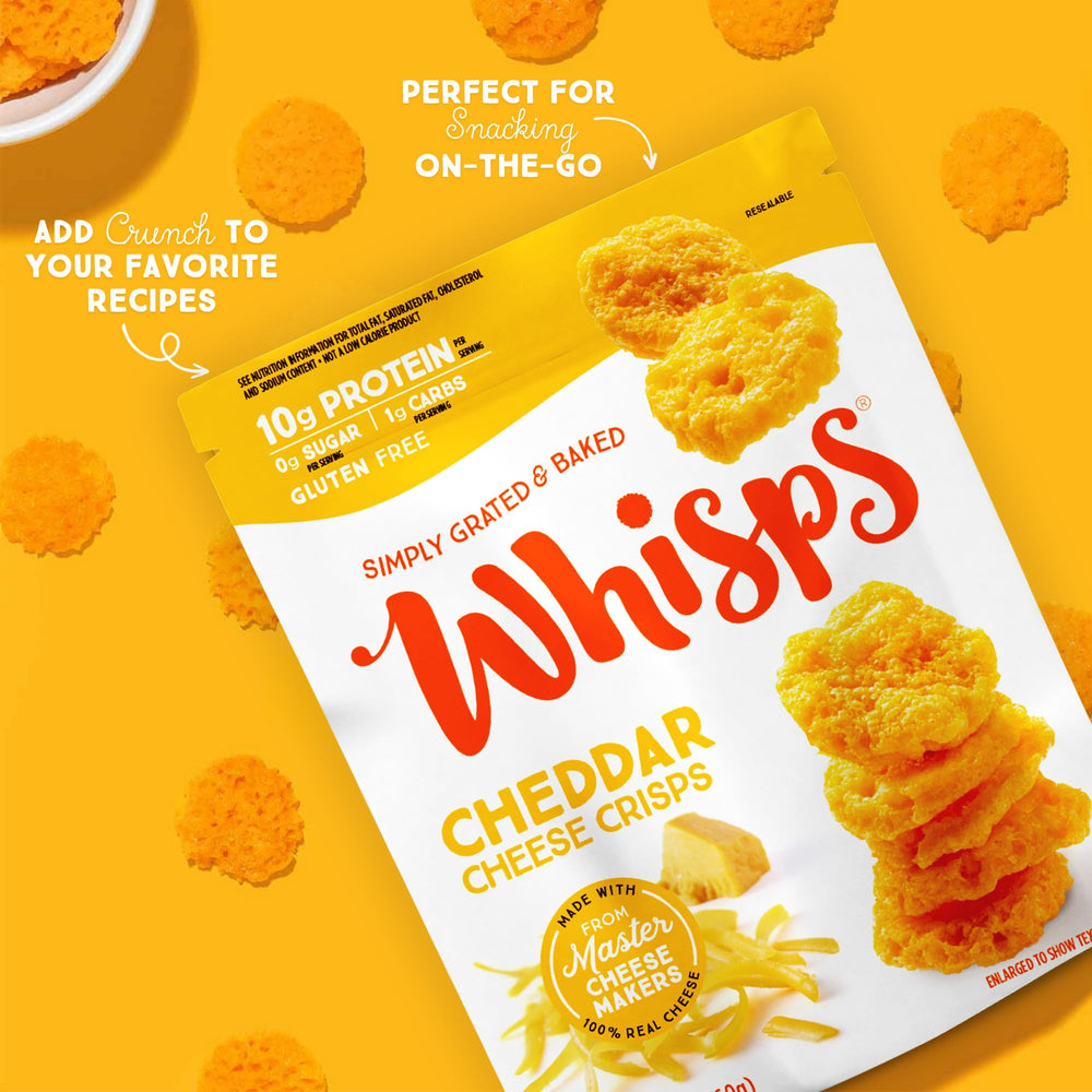 Whisps Cheddar hand grabbing crisp for quick on-the-go bite.