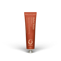 WholyMe Muscle Relief Balm jar being applied to soothe tense muscles.