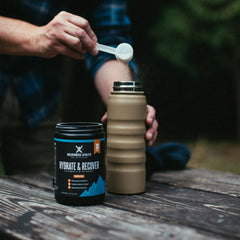 Wilderness Athlete Hydrate & Recover berry-blast glass features a refreshing post-workout drink.