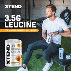 Xtend Original BCAA powder dissolving in water with electrolytes visible.