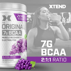 Xtend Original being poured, sugar-free BCAA powder for training sessions.