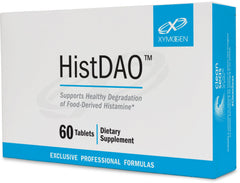 XYMOGEN HistDAO tablet in hand for convenient digestion support.