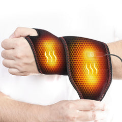 Yabuu wrist heat pad massage in action on desk boosts comfort during work.