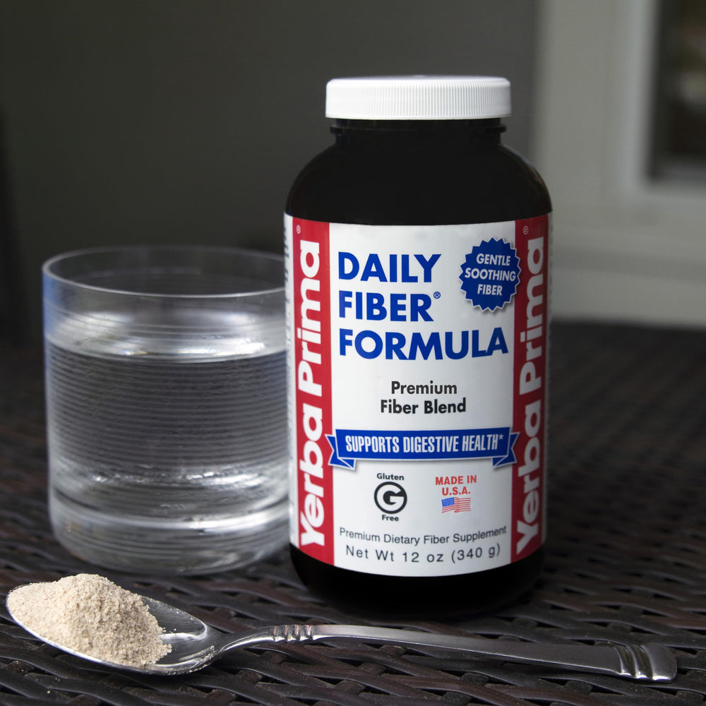 Pouring Yerba Prima Daily Fiber Formula into a glass for a fiber-rich drink.