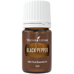 Young Living Black Pepper essential oil bottle pour evokes a spicy aroma for energy and focus.