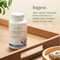Young Living ComfortTone capsules bottle closeup shows a natural herb blend for balanced digestion.