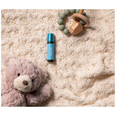 Young Living KidScents SniffleEase roll-on in use demonstrates on-the-go convenience.
