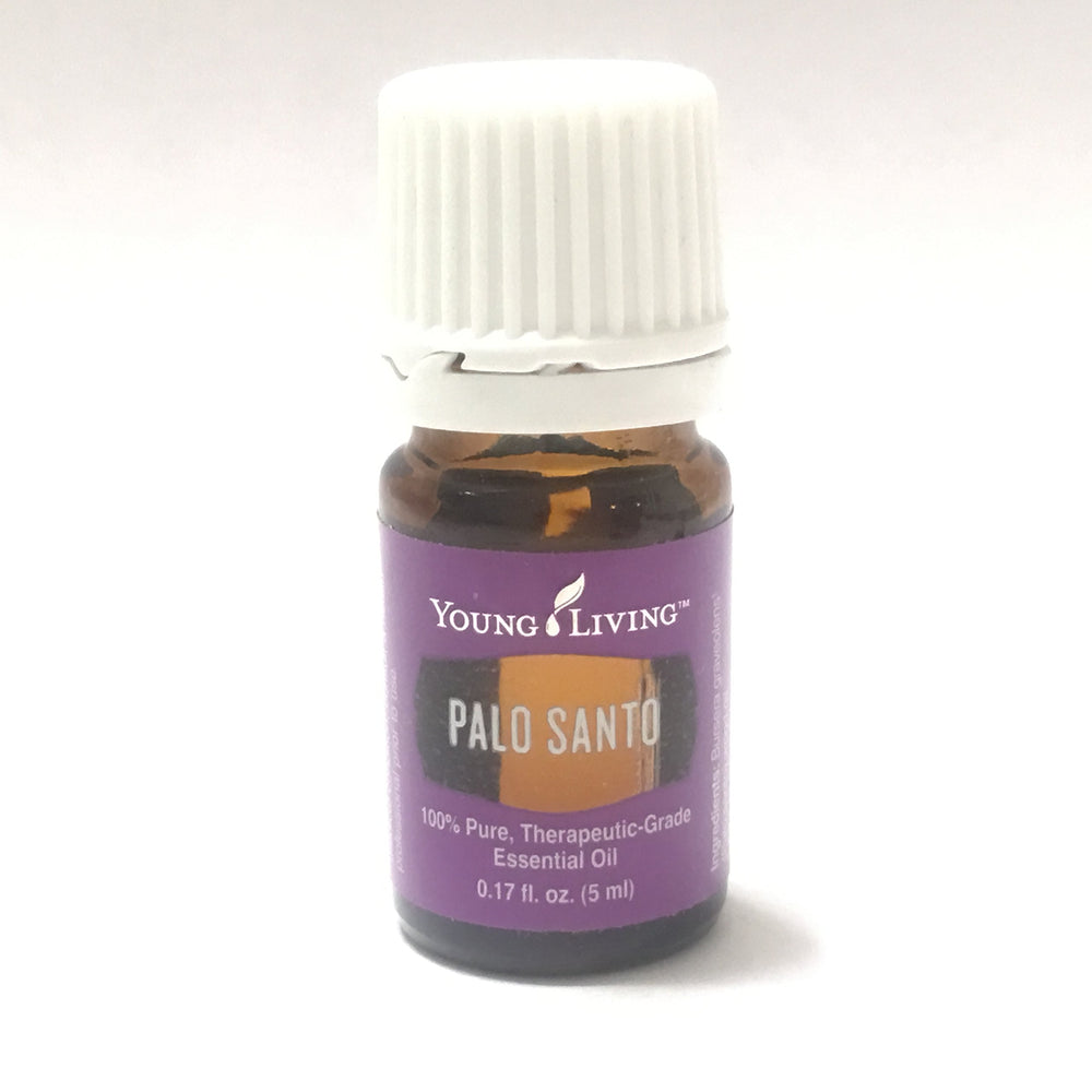 Young Living Palo Santo essential oil bottle pour showing a rich woodsy aroma for grounding.