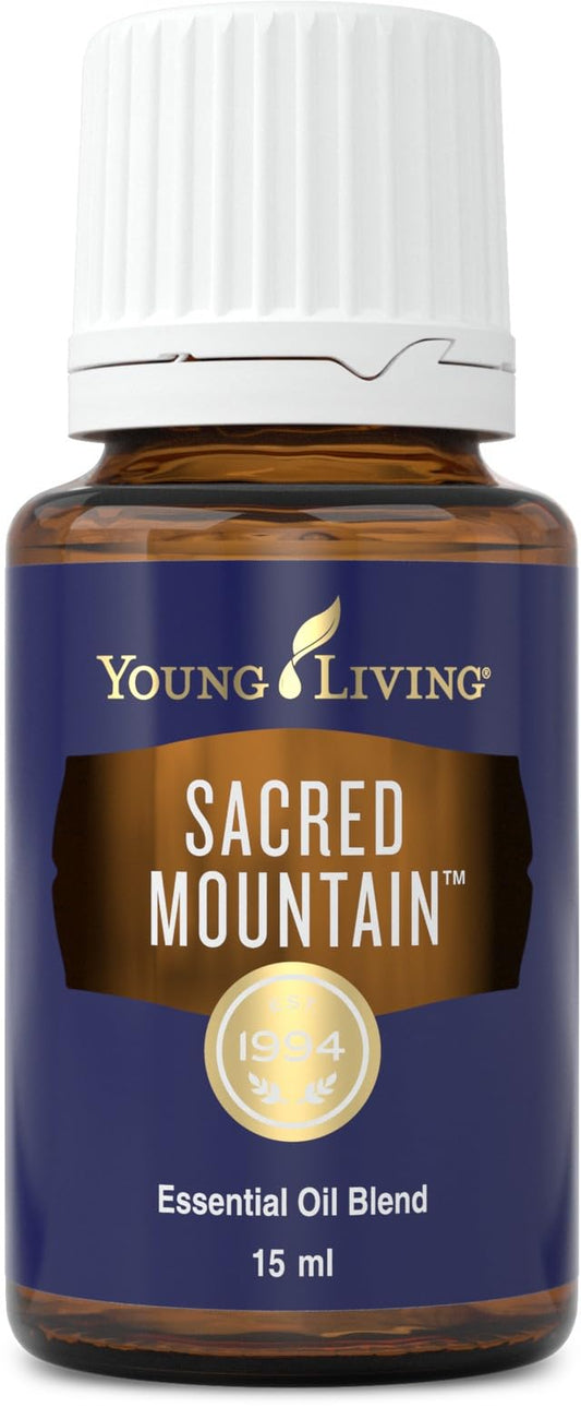Young Living Sacred Mountain bottle pour for uplifting diffusion and grounding ambiance.