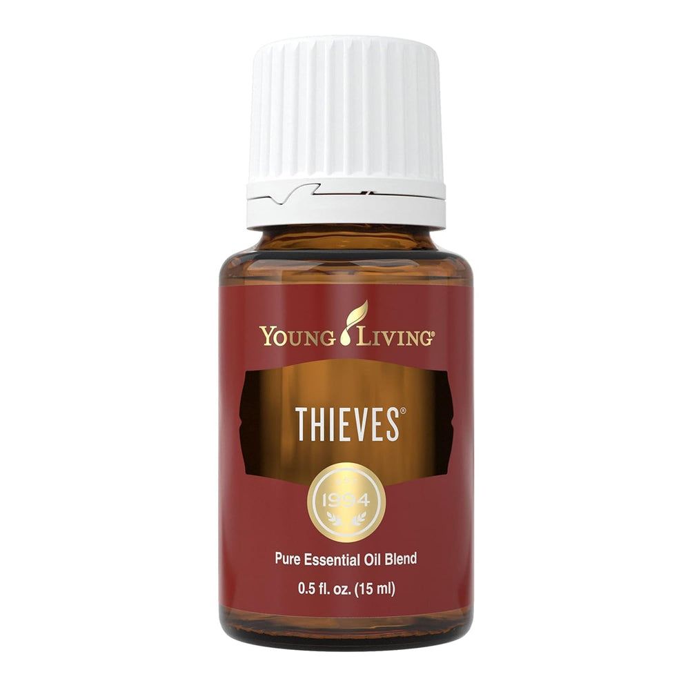 Young Living Thieves bottle pour for daily refreshing aroma and mood support.