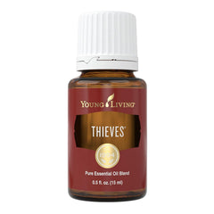 Young Living Thieves bottle pour for daily refreshing aroma and mood support.