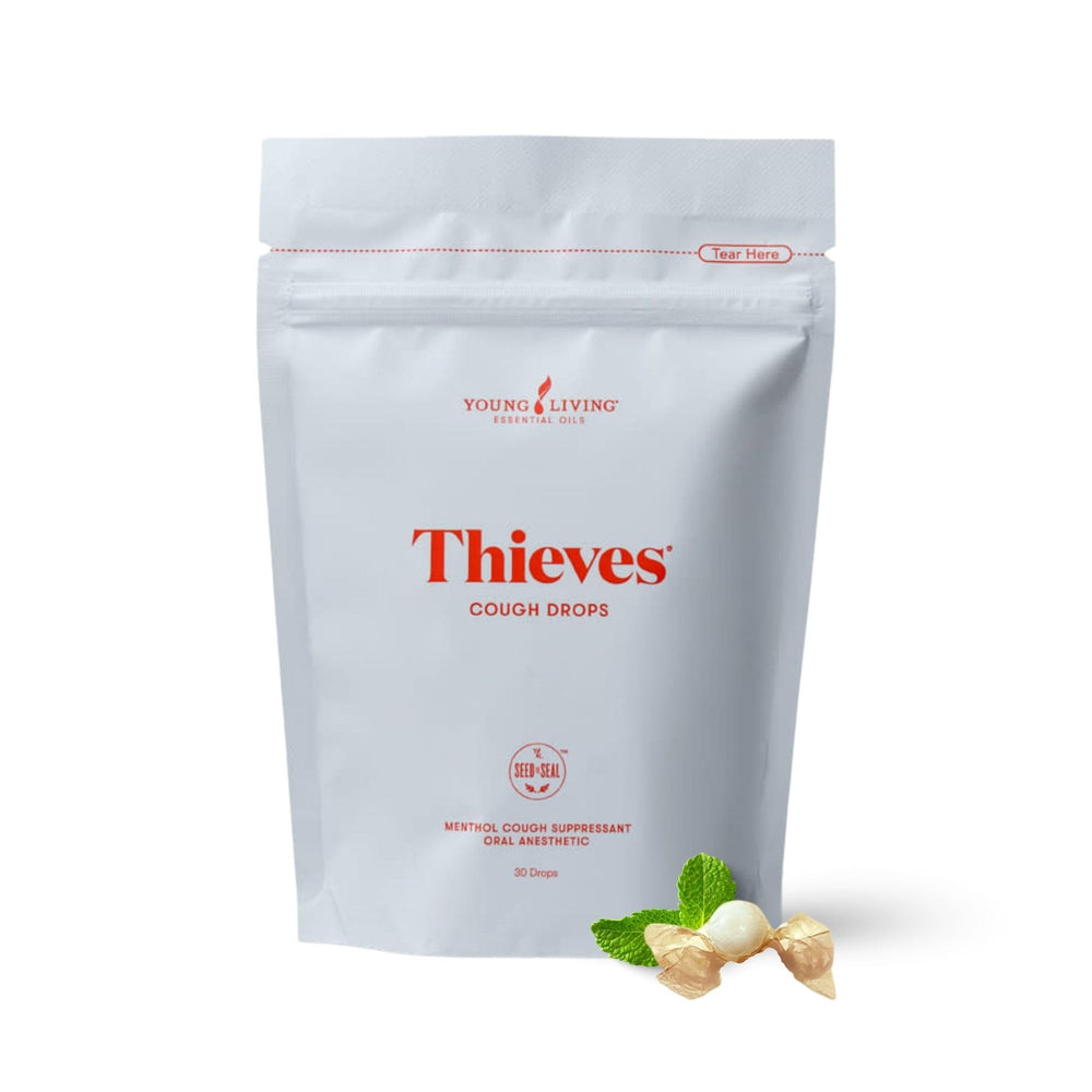 Young Living Thieves Cough Drops 30 count bottle on a clean desk, ideal for on-the-go use.