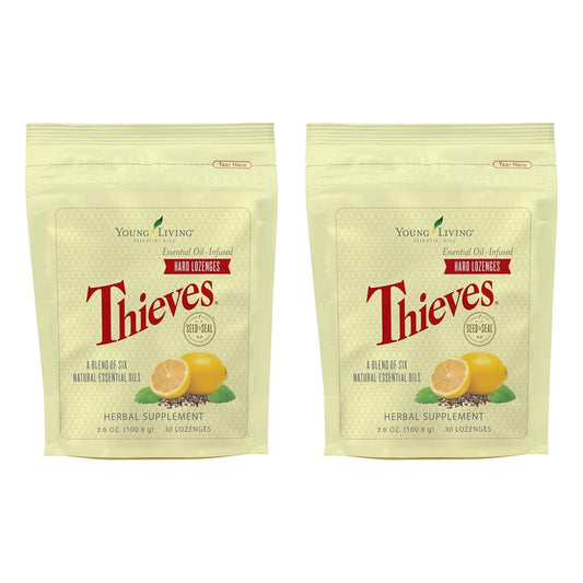 Young Living Thieves Hard Lozenges packaging on a desk for on-the-go use