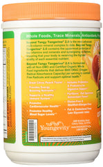 Pouring Beyond Tangy Tangerine 2.0 into water for a quick daily boost.