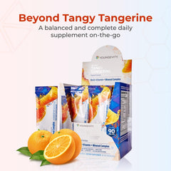 Youngevity Beyond Tangy Tangerine bottle pour highlights easy dosing for busy mornings.