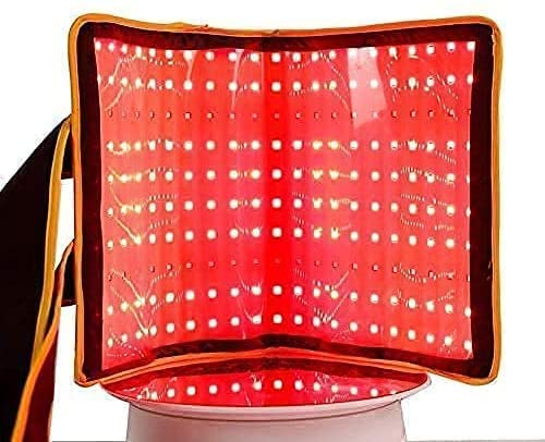 ZorMu red-light therapy belt around the abdomen for targeted contouring and warmth.