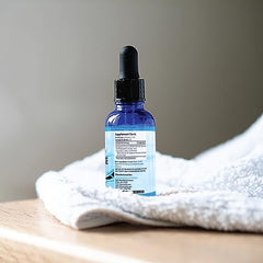 Absonutrix Serrapeptase enzyme bottle label shows potency and ingredients.