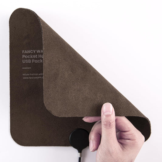 ADD.HERES heating pad back view shows ultra-thin compact design for travel warmth.