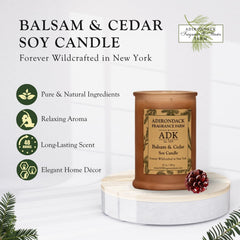 ADK Balsam & Cedar candle burning softly for warm ambiance.