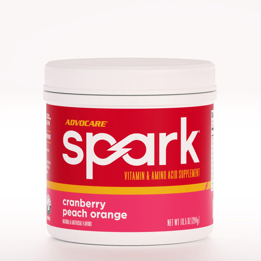 AdvoCare Spark tub front with Cranberry Peach Orange flavor for energy and focus.