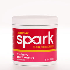 AdvoCare Spark tub front with Cranberry Peach Orange flavor for energy and focus.